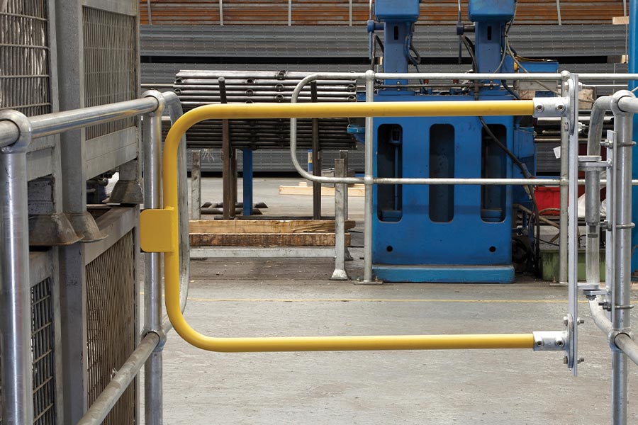 A Kee Gate self-closing gate fitted between guardrail uprights